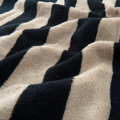 Thick, black and beige striped towel, soft & absorbent.