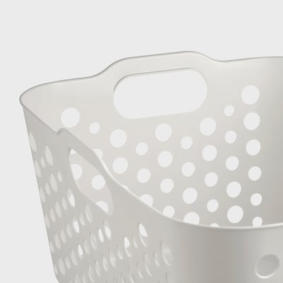 White perforated plastic laundry basket with rounded handles, sturdy and ventilated.