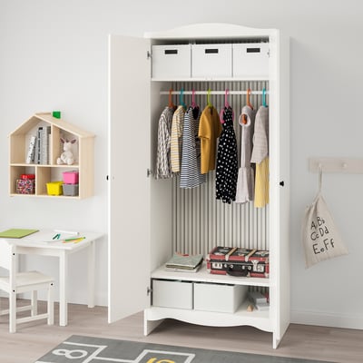 Kids wardrobe with clothes rail, shelves, and safety. Wardrobe is open, displaying clothes and organised storage.