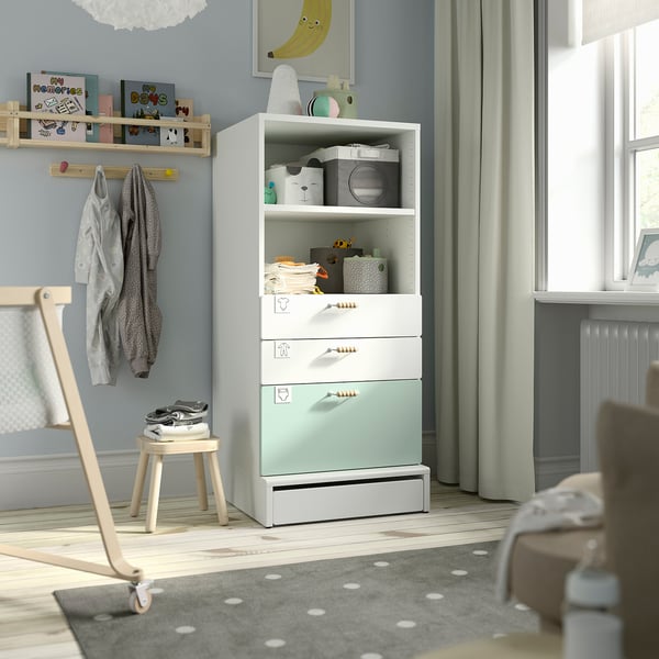 Kids room: mint SMÅSTAD bookcase, rug, chair.