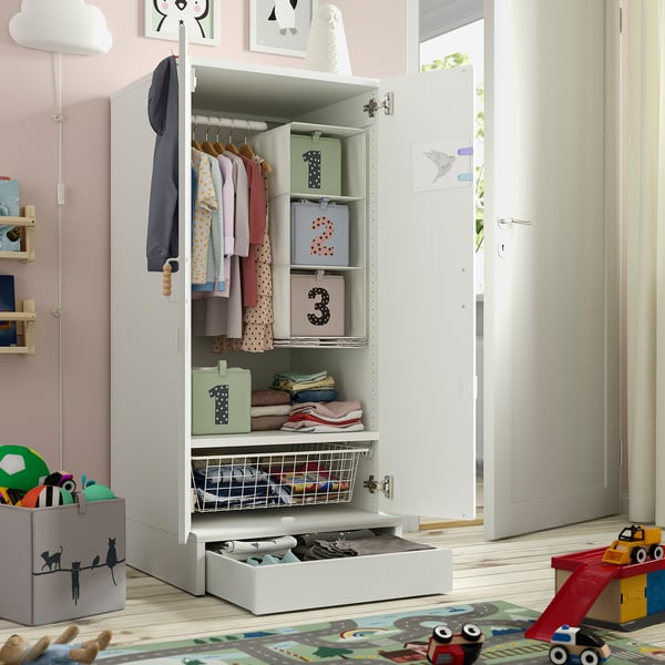 Childrens wardrobe with clothes and boxes; soft-close doors; adjustable shelves and drawers.