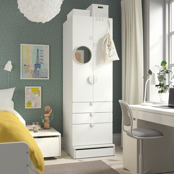 Modern bedroom with SMÅSTAD wardrobe, mirror, art, and yellow pillow.