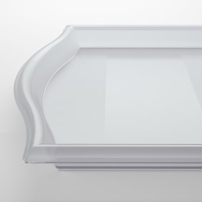 Clear plastic tray with smooth, sloped edges, resting on a white surface.