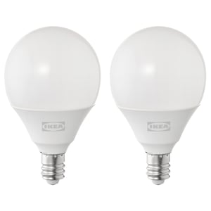 Two white ikea spherical led bulbs with silver base, standing side by side.