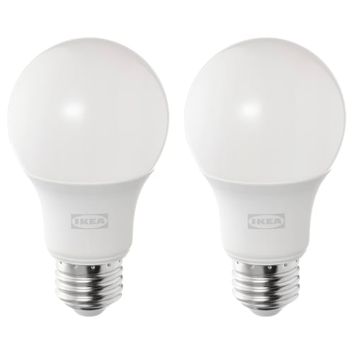 Two white ikea SOLHETTA led bulbs, spherical shape, warm white light, stand upright.