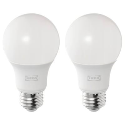 Two white ikea SOLHETTA led bulbs, spherical shape, warm white light, stand upright.