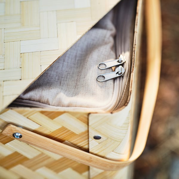 Close-up of high-quality bamboo zippered compartment, showing sleek design and sturdy construction.