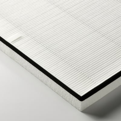 White rectangular air philtre with textured surface, black border on edge, suggesting quality and efficiency in particle removal.