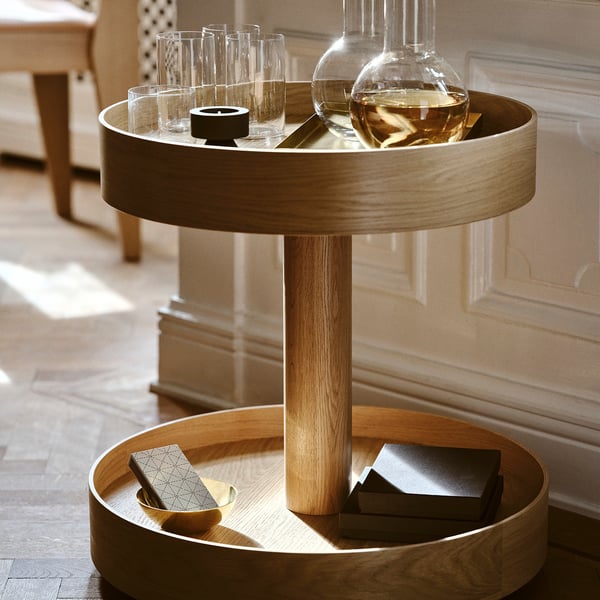 Modern scandinavian serving trolley, oak wood, two-tiered, minimalist design, fits in small spaces.