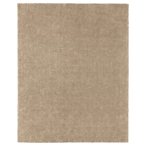 A beige, rectangular STOENSE rug with a simple design, made from polypropylene.