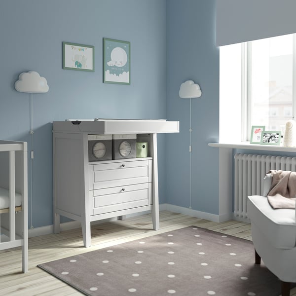 SUNDVIK white nursery unit, drawers, changing table, blue walls, cloud lamps, grey carpet.