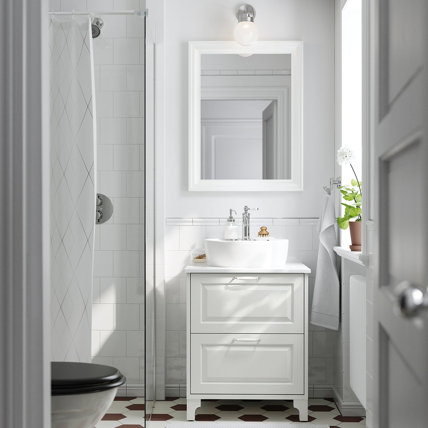 White bathroom: vanity, round basin, wall mirror, towel, white-tiled shower, glass door, black-white floor.