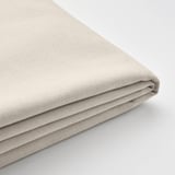 Folded beige fabric, soft texture, smooth weave, neatly layered.