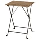 A TÄRNÖ outdoor table with a wooden top and black metal legs, foldable design.