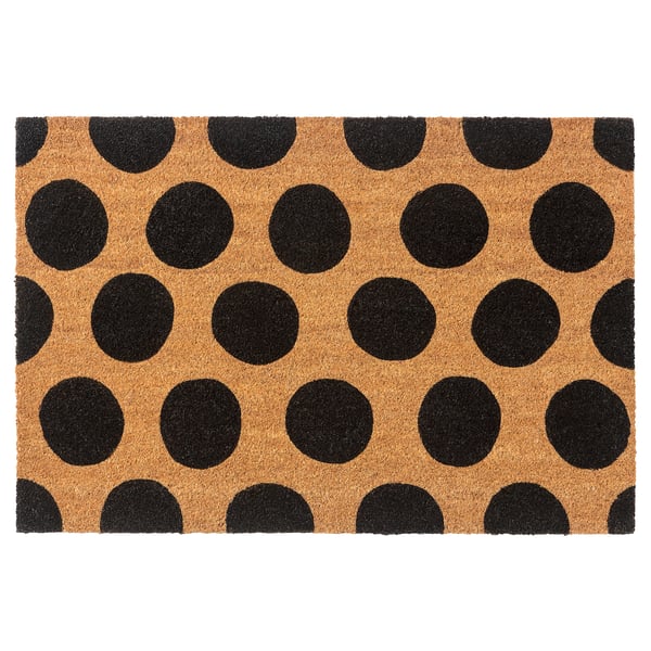 Black-and-tan polka dot doormat, rectangular, made of coir with jute backing.