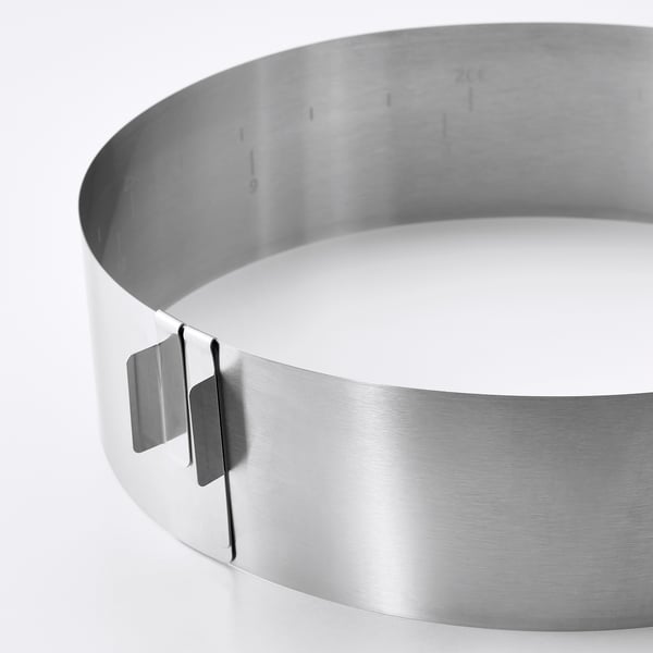 Stainless steel baking frame, adjustable, high-quality finish, shown in close-up.