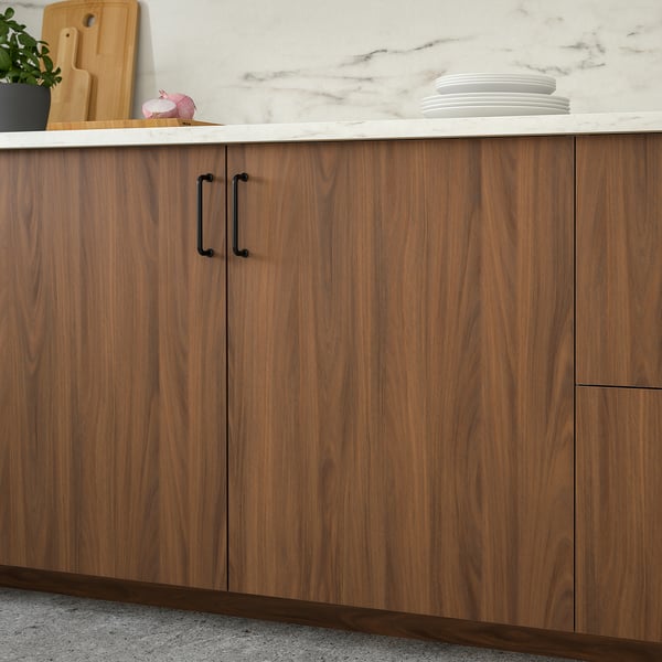 Wooden kitchen cabinets with dark handles and marble countertop, displaying storage and modern design with walnut finish.