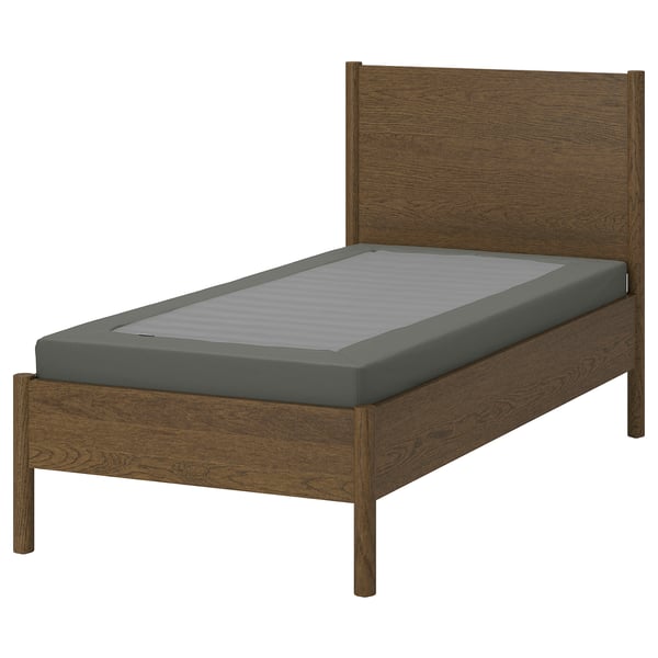 The TONSTAD wooden bed frame in brown with a grey mattress. The frame is sturdy with a classic design and brushed veneer finish.