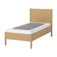 The TONSTAD bed in light wood has a classic design with a sturdy oak frame and a white mattress.