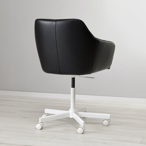 Black office chair with soft, padded leather seat and back. A white five-legged base with wheels, providing stability and mobility.