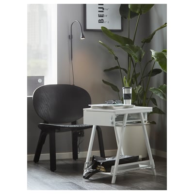 Small, modern white desk with drawer and shelf, sleek design, perfect for compact spaces.