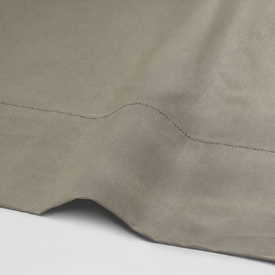 Close-up of smooth, high-thread-count cotton-lyocell fabric, showcasing crisp texture and fine stitching.