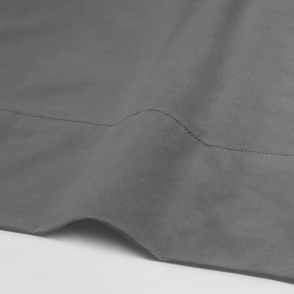 Grey bed sheet with crisp, high thread count percale weave, displaying tight stitching and soft texture.