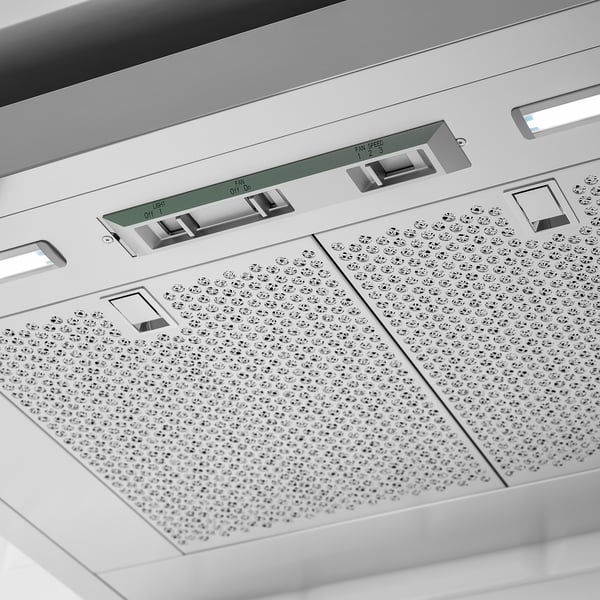 Modern stainless steel range hood with control panel and efficient ventilation.