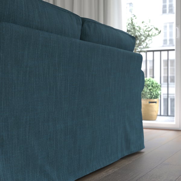Teal UPPLAND sofa near window, comfy & easy-clean.