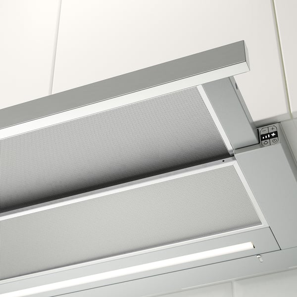 A modern, built-in range hood with a sleek and minimalist design, featuring perforated metallic panels and integrated led lighting.