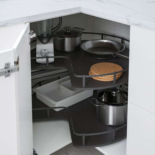 Kitchen corner carousel stores pots, pans, saving space, easy access.
