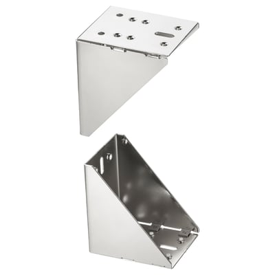 Two metallic UTRUSTA corner brackets, nickel-plated, and triangular shaped.
