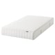 IKEAs white VALEVÅG rolled mattress, featuring stretch fabric with a zip, for medium-firm comfort.