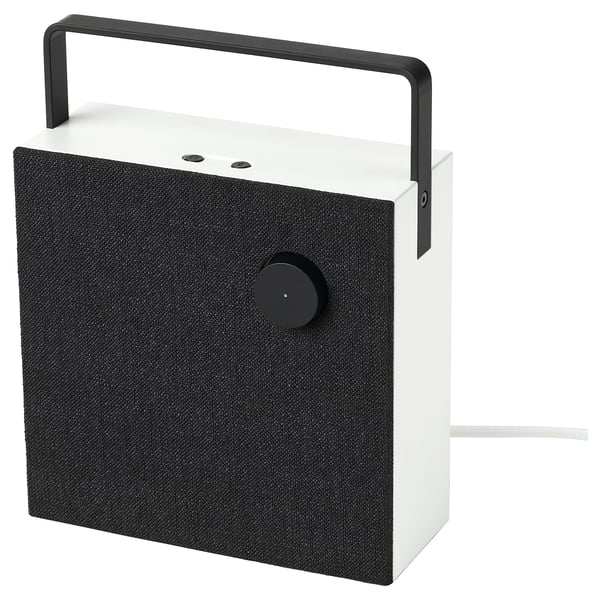 Bluetooth speaker: white, fabric front, black handle, modern.