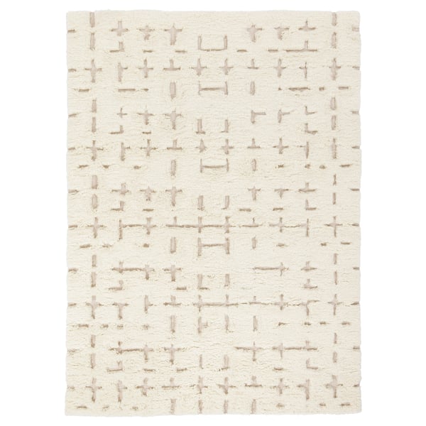 White rug with beige geometric pattern, rectangular, handwoven.