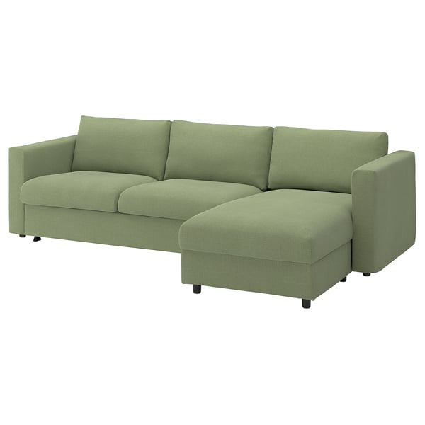 A green VIMLE sectional sofa with a chaise lounge and ottoman, featuring a sofa-bed with storage.