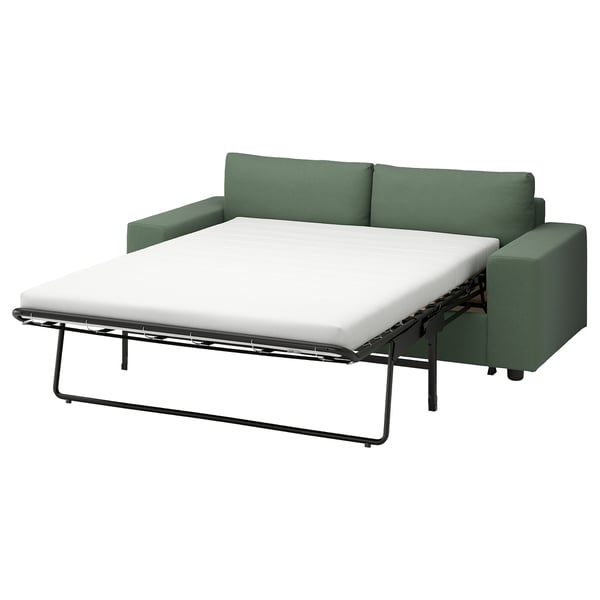A green VIMLE sofa-bed with a white mattress, modern design, and metal frame.