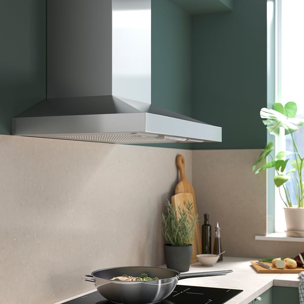 Stainless steel kitchen hood, sleek and modern, mounted above stove. VINSTGIVANDE model, fits well in contemporary kitchen designs. Size: medium.