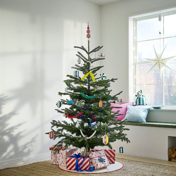 Small, colourful VINTERFINT christmas tree with presents, featuring bright ornaments and a red star on top.