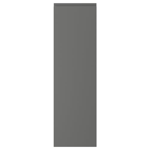 A dark grey VOXTORP cabinet door with a sleek, modern design. The door has integrated handles and a smooth finish.